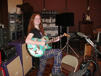 Jessie Seely playing guitar.